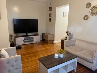 Living room with hardwood floors at Acapulco