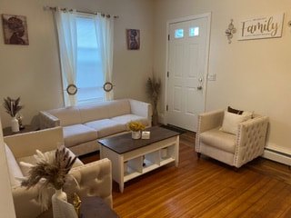 Living room with hardwood floors at Acapulco