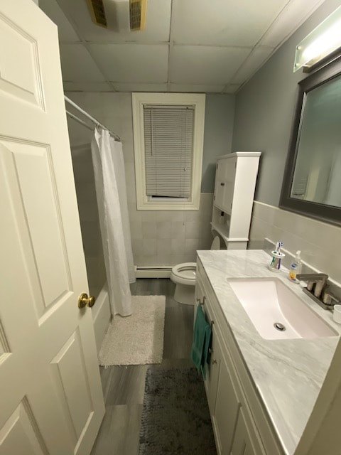 Renovated bathroom with tile and a granite vanity at Aruba