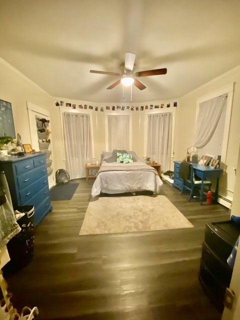 Bedroom with hardwood floors and natural light at Aruba