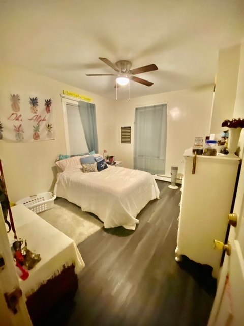 Bedroom with hardwood floors and natural light at Aruba