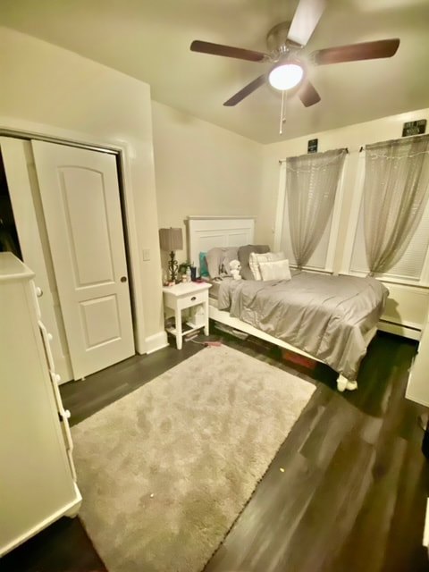 Bedroom with hardwood floors and natural light at Aruba