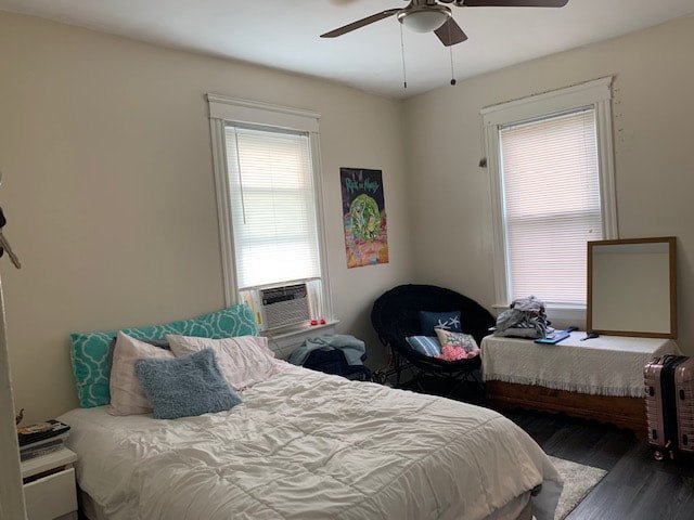 Bedroom with hardwood floors and natural light at Aruba