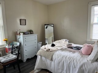 Bedroom with hardwood floors and natural light at Bahamas