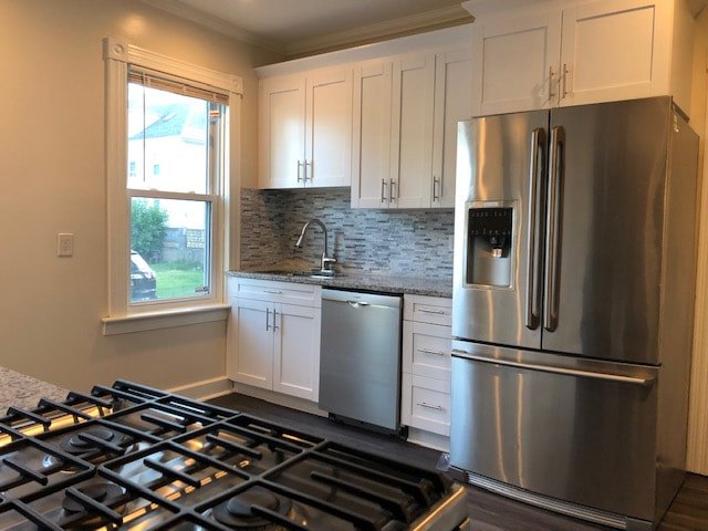 Renovated kitchen with wood cabinets and stainless appliances at Bahamas