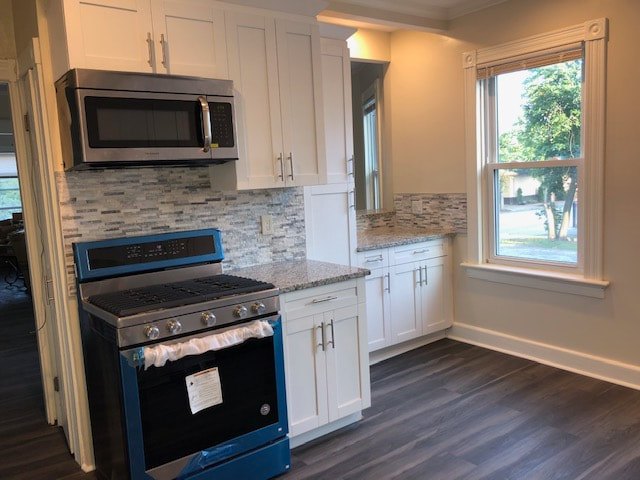 Renovated kitchen with wood cabinets and stainless appliances at Bahamas