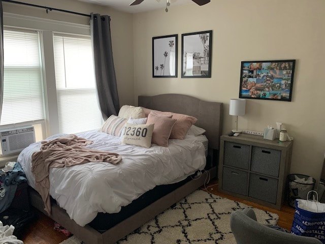 Bedroom with hardwood floors and natural light at Cabo
