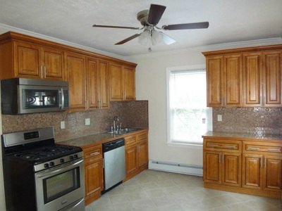 Kitchen with stainless range, dishwasher and wood cabinets at Costa Rica