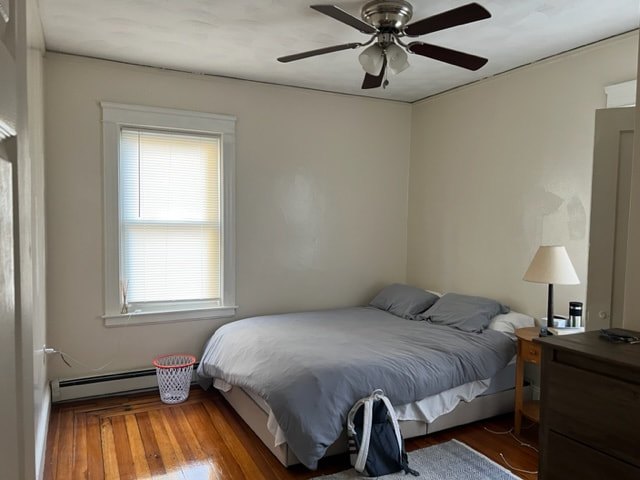 Bedroom with hardwood floors and natural light at Jamaica